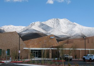 Liberty Center, certified by the U.S. Green Building Council as a LEED Silver green building, with snow-capped Black Mountain in the background.