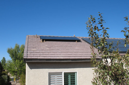 Solar hot water collector panel on Southern Nevada roof.