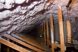 The thermal barrier was relocated to the underside of the roof, creating an insulated attic space.