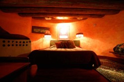 Bedroom in an Earthship - naturally comfortable.